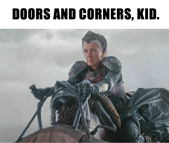 This meme is a photo of a character from the Game of Thrones series, specifically a younger version of the character Melisandre, played by actress Carice van Houten. The text above the image reads "Doors and corners, kid." This is a play on the character's famous phrase "Drinks and kisses, kid," which is a humorous and ironic twist on the original quote.